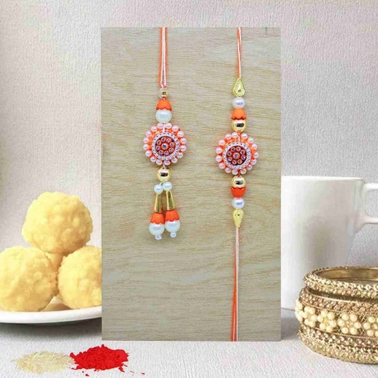 Rakhi for Brother and Bhabhi with Rakshabandhan Special Card and Roli Chawal 